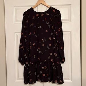 Short and flowy, light weight peplum dress.